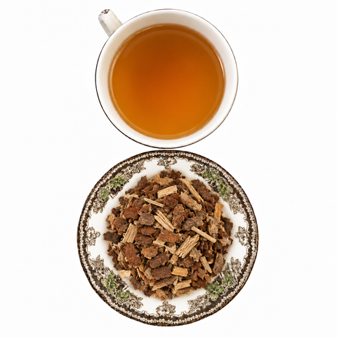 Wild Cherry Bark loose dried herb on a floral transferware plate with a cup of steeped infusion