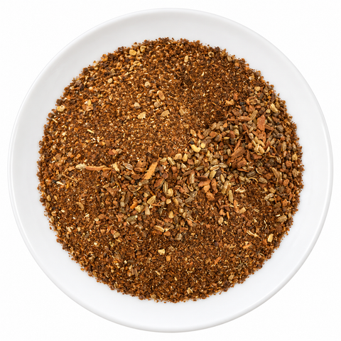 Chinese 5 Spice dry spice blend on a plain white plate