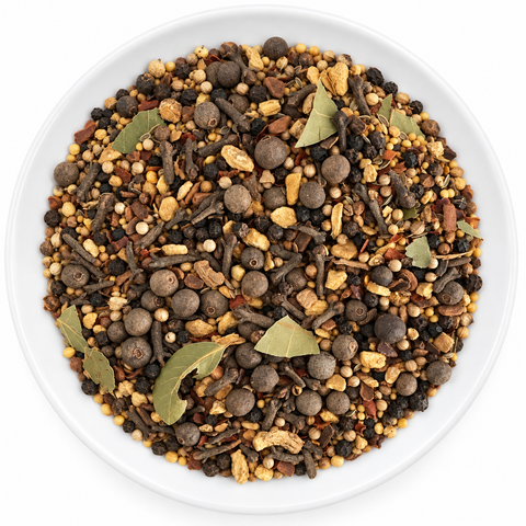 Pickling Spice dry spice blend on a plain white plate