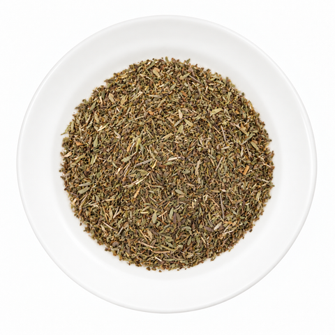 Summer Savory Herb dry spice on a plain white plate against a white background