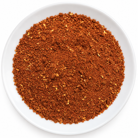 Tikka Masala dry spice on a plain white plate against a white background