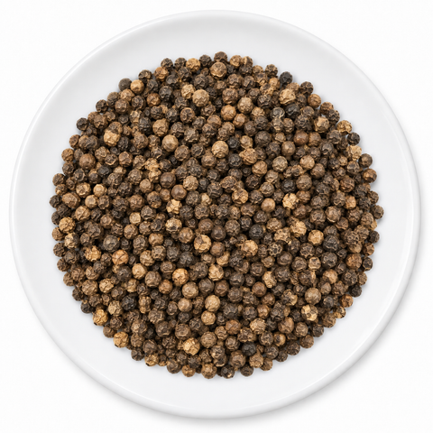 Peppercorn, Black, Whole on a plain white plate
