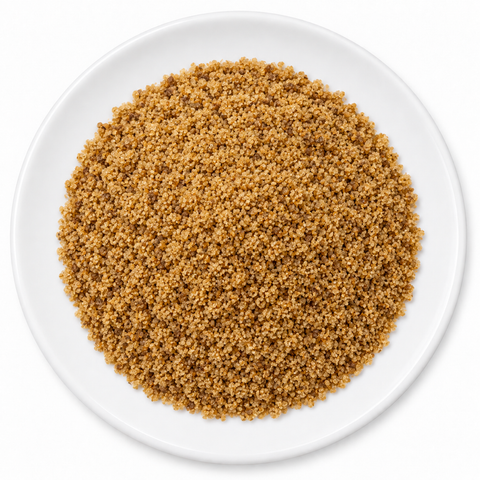 Loose coconut sugar on a plain white plate