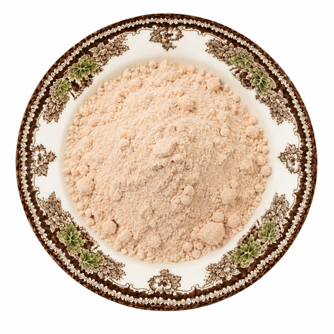 Camu Camu Fruit Extract, Powder on a cream floral plate
