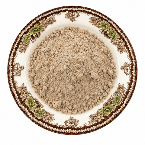 Dandelion Root Powder on a cream floral plate