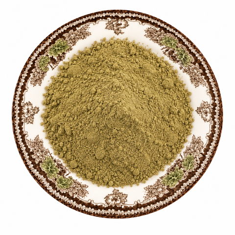 Wheat Grass Powder on a cream floral plate