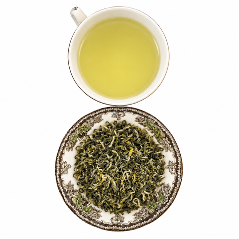 Bi Luo Chun loose-leaf tea with brewed tea on a white background