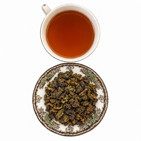 Black Dragon Oolong loose-leaf tea with brewed tea on a white background