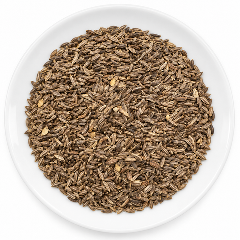 caraway seed, whole dry product on a plain white plate against a white background