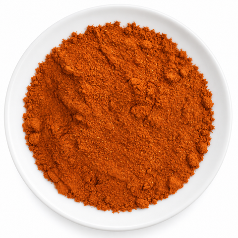 Cayenne, Ground dry product on a plain white plate against a white background