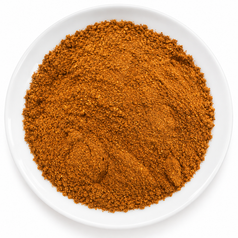 Chipotle Pepper Ground dry product on a plain white plate against a white background