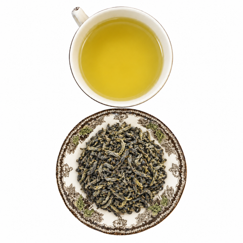Chunmee Green loose-leaf tea with brewed tea on a white background