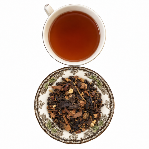 Cinnamon Oolong Chai loose-leaf tea with brewed tea on a white background