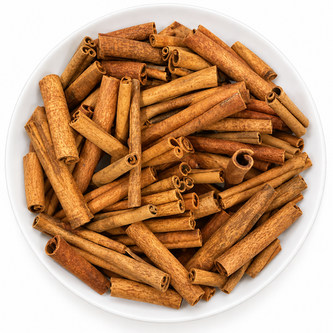 Cinnamon Sticks (Ceylon) dry product on a plain white plate against a white background