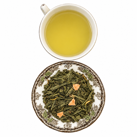 Citrus Green Tea loose-leaf tea with brewed tea on a white background