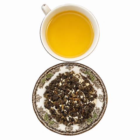 Coconut Milky Oolong loose-leaf tea with brewed tea on a white background