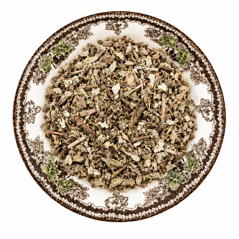 Coltsfoot Organic dry product on a floral transferware plate against a white background