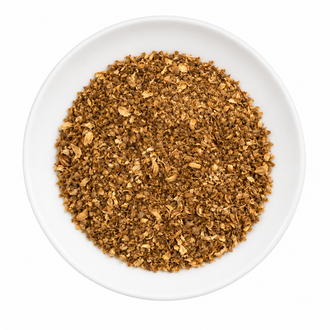 Coriander Seed Powder dry product on a plain white plate against a white background