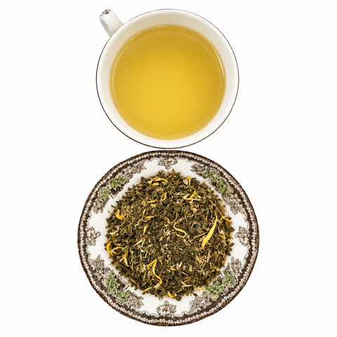 Decaf Mango Green Tea Organic loose-leaf tea with brewed tea on a white background