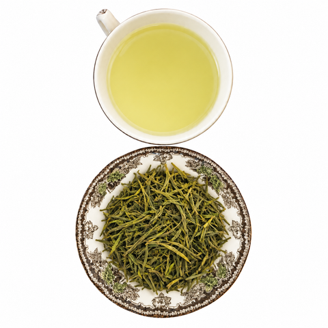 Finest Anji White loose-leaf tea with brewed tea on a white background