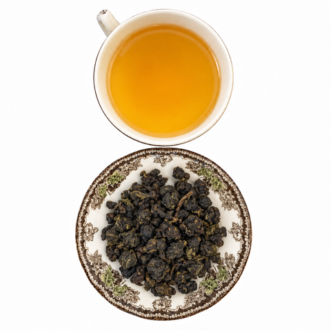 Gaba Oolong, Organic loose-leaf tea with brewed tea on a white background