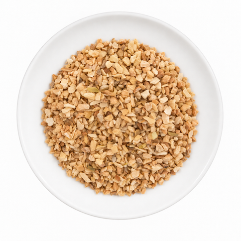 Garlic Minced dry product on a plain white plate against a white background