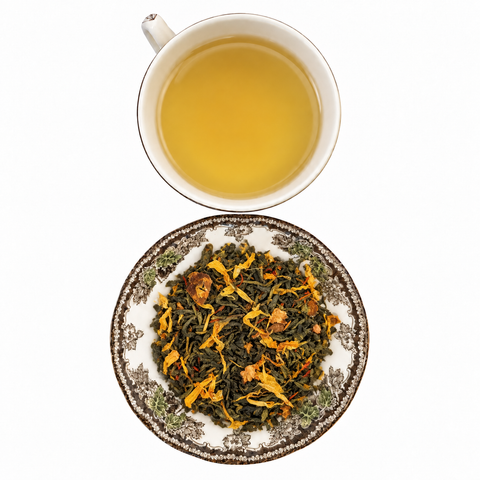 Ginger Orange Peach Organic loose-leaf tea with brewed tea on a white background