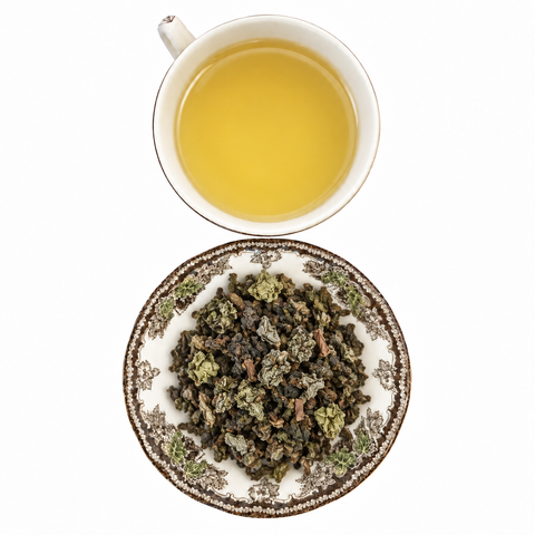 Golden Flower Oolong loose-leaf tea with brewed tea on a white background