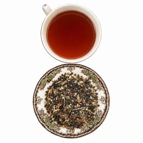 High Energy Chai loose-leaf tea with brewed tea on a white background