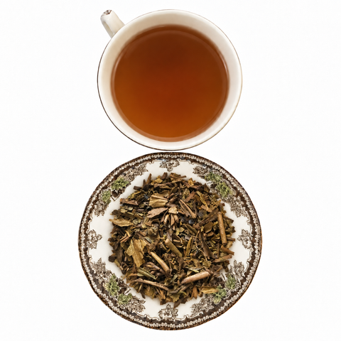 Hojicha loose-leaf tea with brewed tea on a white background