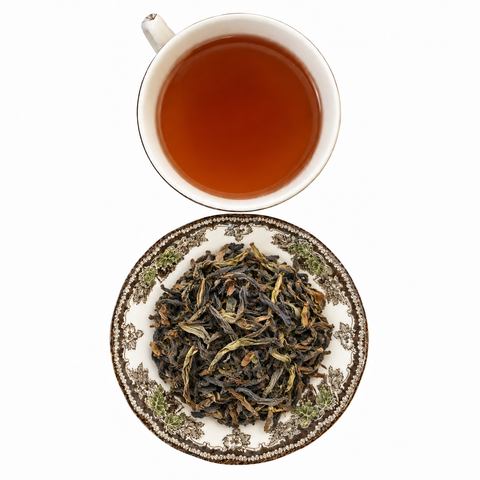 Jasmine Shui Xian Narcissus Oolong loose-leaf tea with brewed tea on a white background