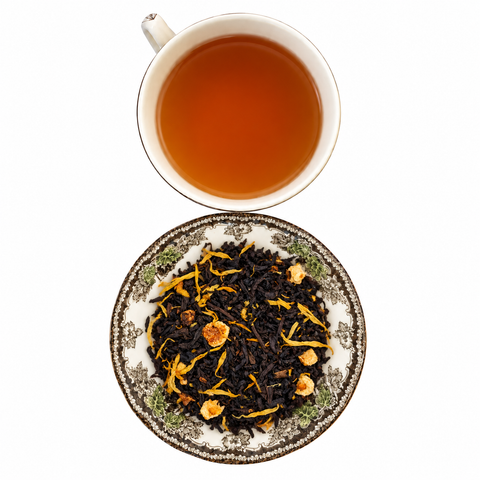 Lady Grey loose-leaf tea with brewed tea on a white background