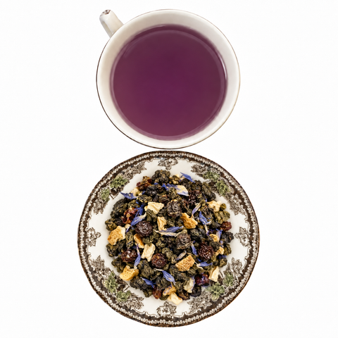 Lychee Mariposa loose-leaf tea with brewed tea on a white background