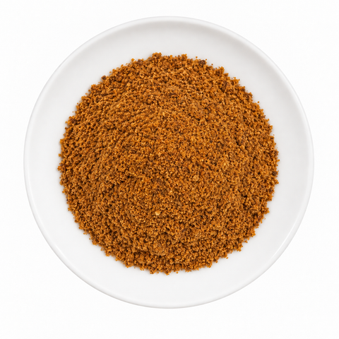 mace, powder dry product on a plain white plate against a white background