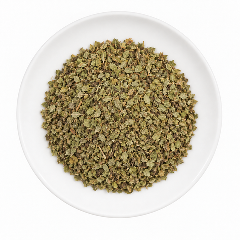 Marjoram dry product on a plain white plate against a white background