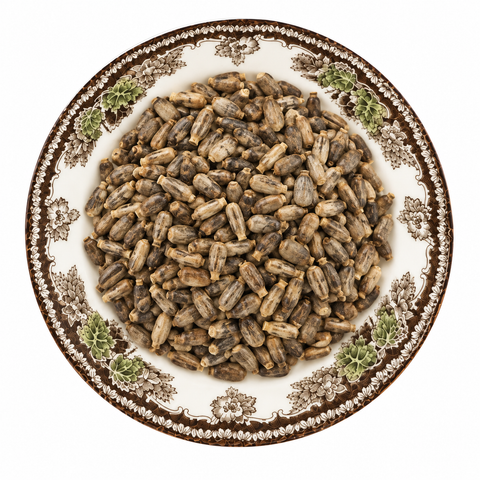 Milk Thistle Seed dry product on a floral transferware plate against a white background
