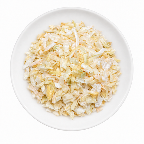 Onion Chopped dry product on a plain white plate against a white background