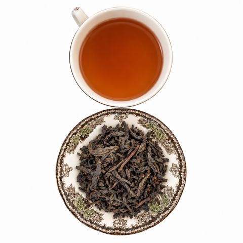 Oolong Qilan Organic loose-leaf tea with brewed tea on a white background