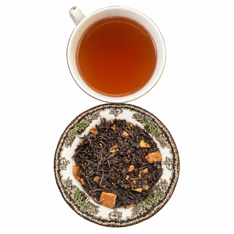 Orange Spice Cinnamon Tea loose-leaf tea with brewed tea on a white background