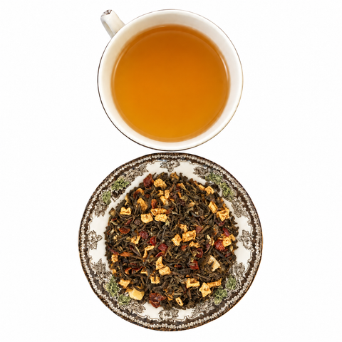 Pineapple Darjeeling loose-leaf tea with brewed tea on a white background