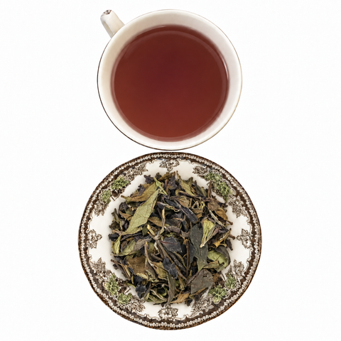 Purple White loose-leaf tea with brewed tea on a white background