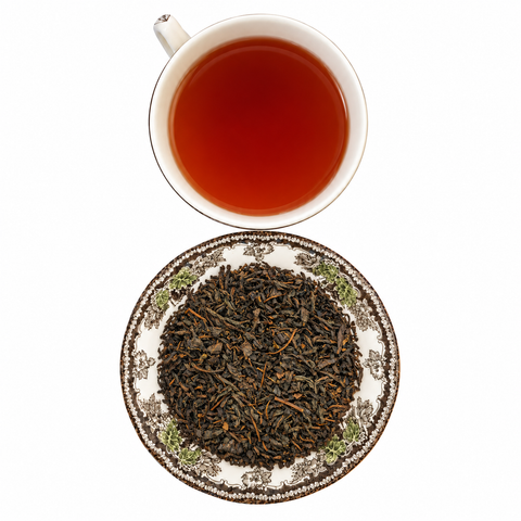 Russian Caravan loose-leaf tea with brewed tea on a white background