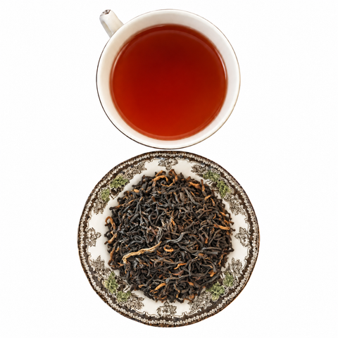 Scottish Breakfast loose-leaf tea with brewed tea on a white background