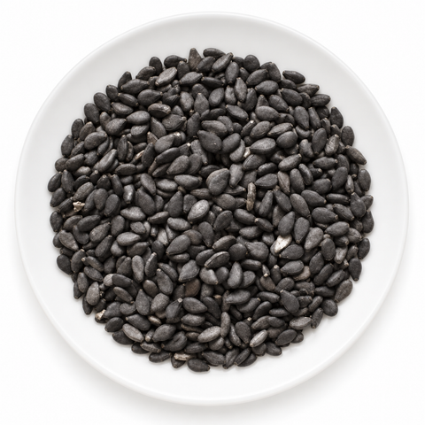 Sesame Seed, Black dry product on a plain white plate against a white background