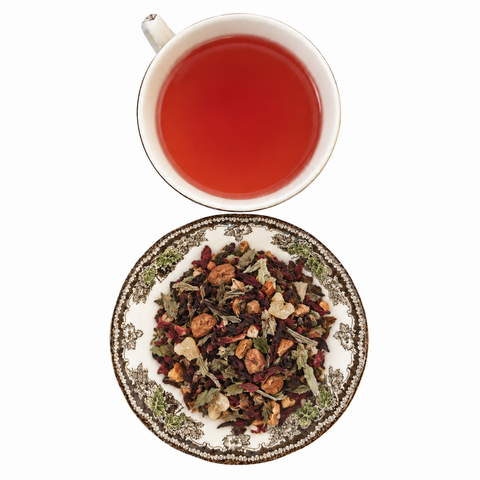spiced white pear loose-leaf tea with brewed tea on a white background