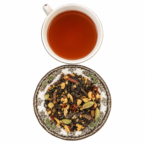 Spicy Chili Pepper Chai loose-leaf tea with brewed tea on a white background