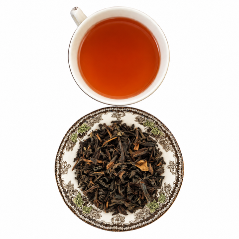 Tarry Lapsang Souchong Superior loose-leaf tea with brewed tea on a white background