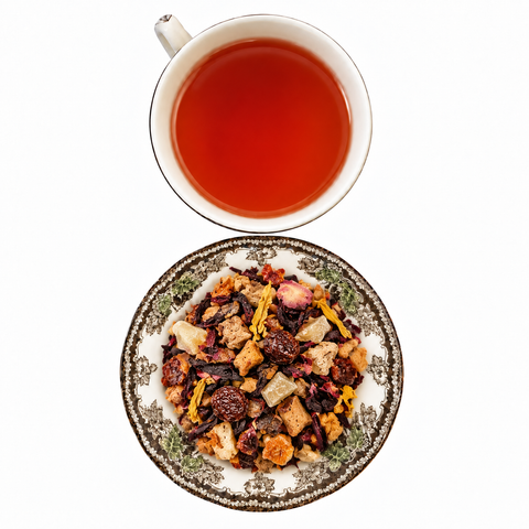 Warm Spiced Pear dry tea and prepared tea on a white background