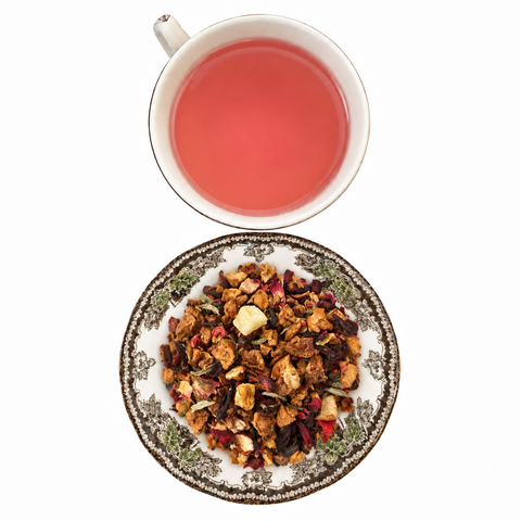 White Fruit Medley loose-leaf tea with brewed tea on a white background