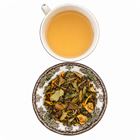 White Peach loose-leaf tea with brewed tea on a white background